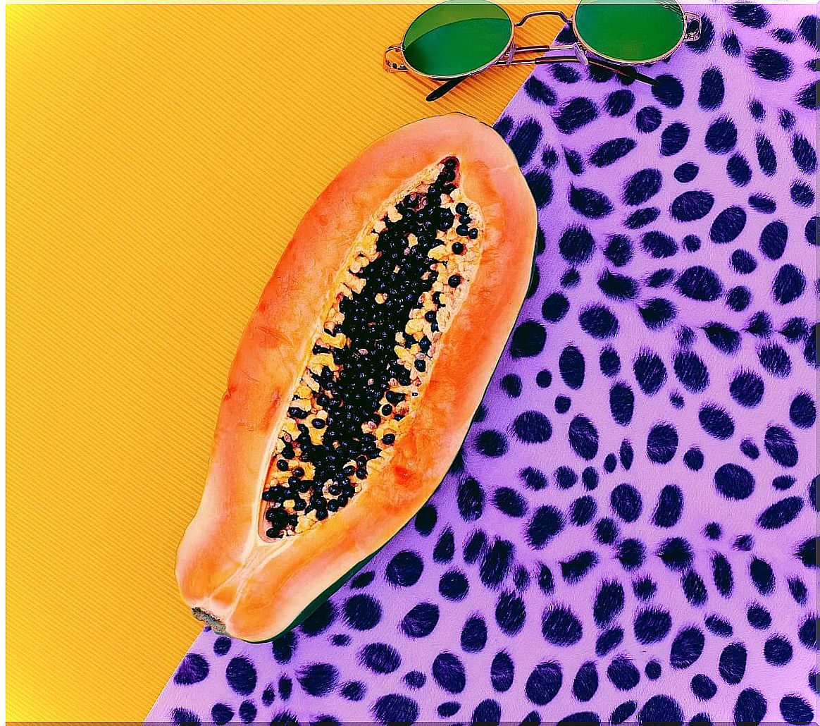 A papaya with a colorful background.